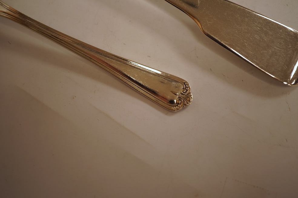 A 19th century matched part canteen of 19th century silver fiddle pattern flatware including a soup ladle and a sauce ladle, twelve table spoons, eight table forks, eight dessert forks, eight dessert spoons and six teasp